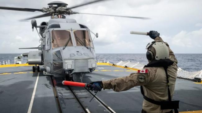 解放军南海再惹争议 近距离对加直升机发照明弹